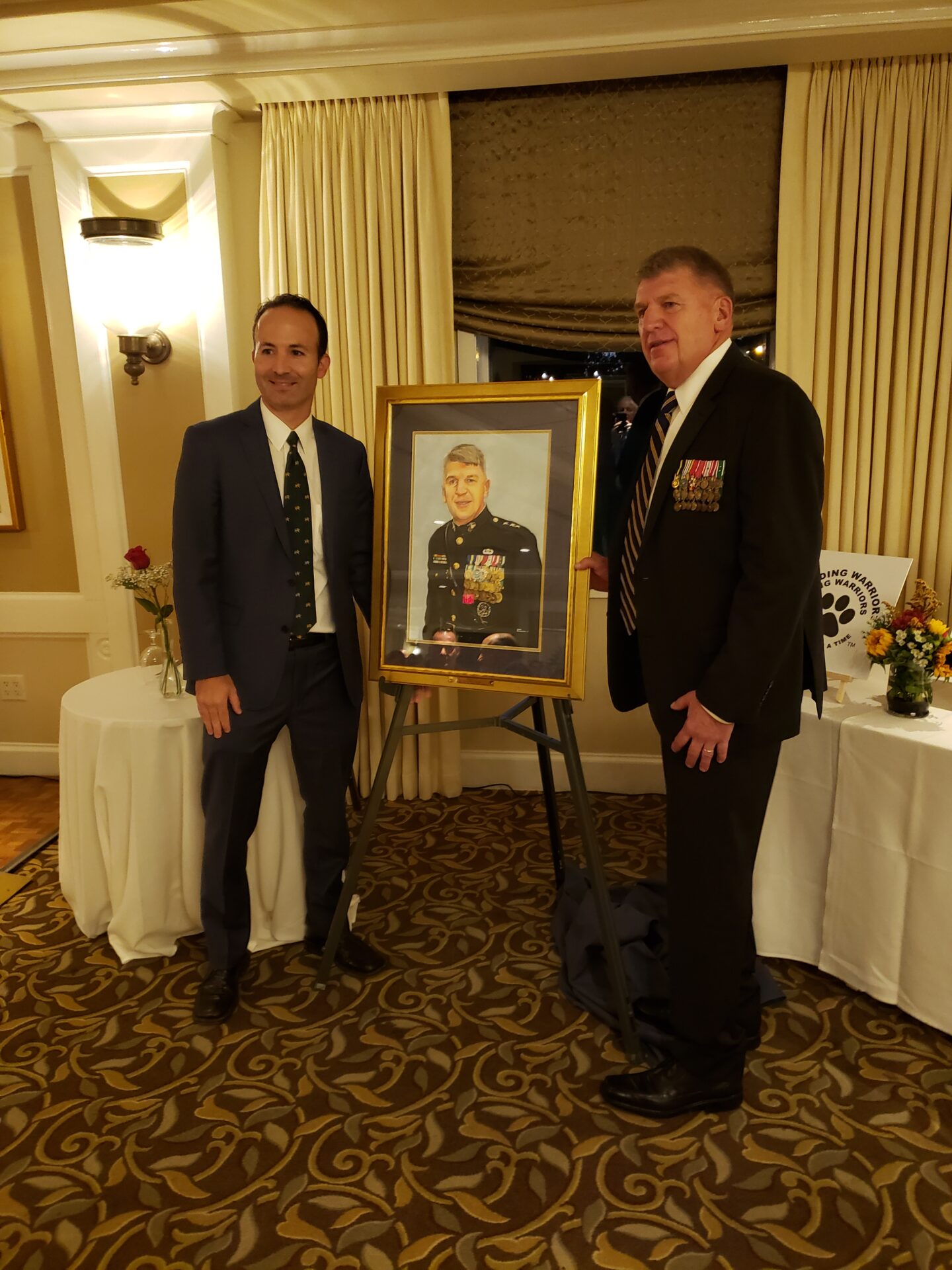 Artist James Fiorentino presents a portrait to Lt. General Richard Natonski, USMC.